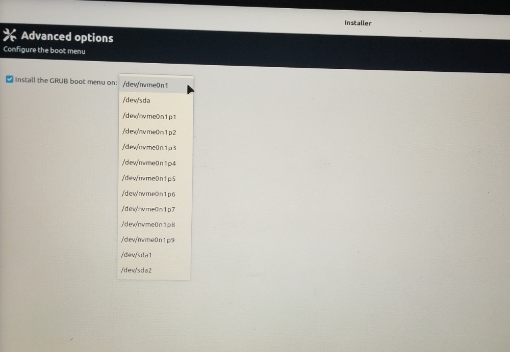 Calamares "Install the GRUB boot menu on" dropdown with /dev/nvme0n1 selected